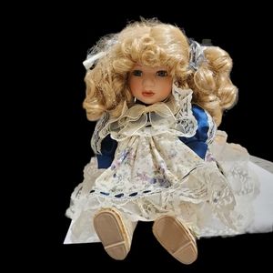 Vintage porcelain musical doll